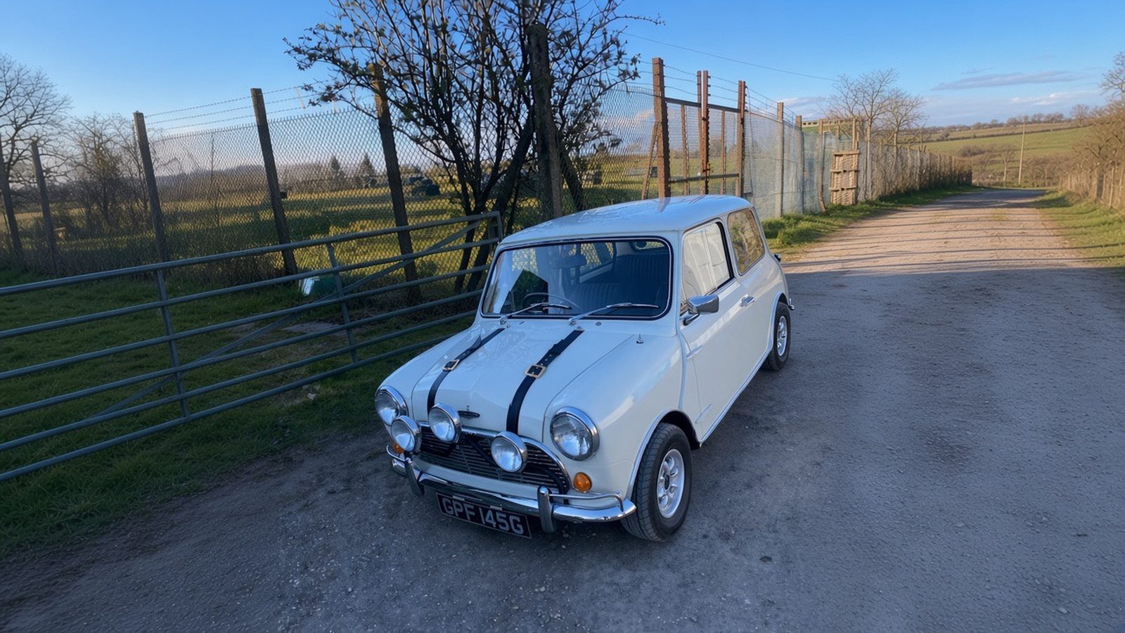 White Italian Job Mini wedding car with black bonnet stripes and four lamps