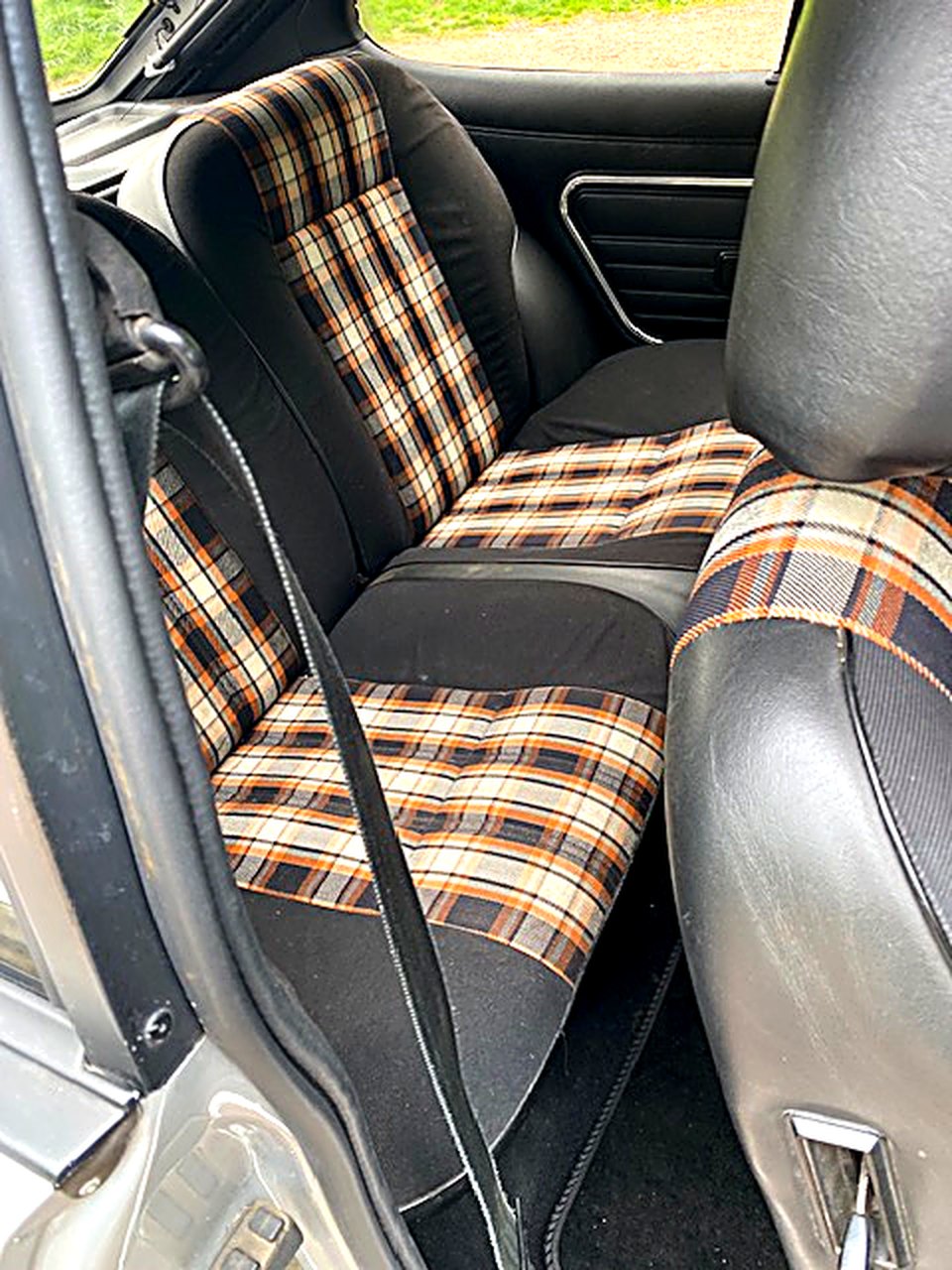 Tartan check rear seats inside the Ford Capri 3.0 S